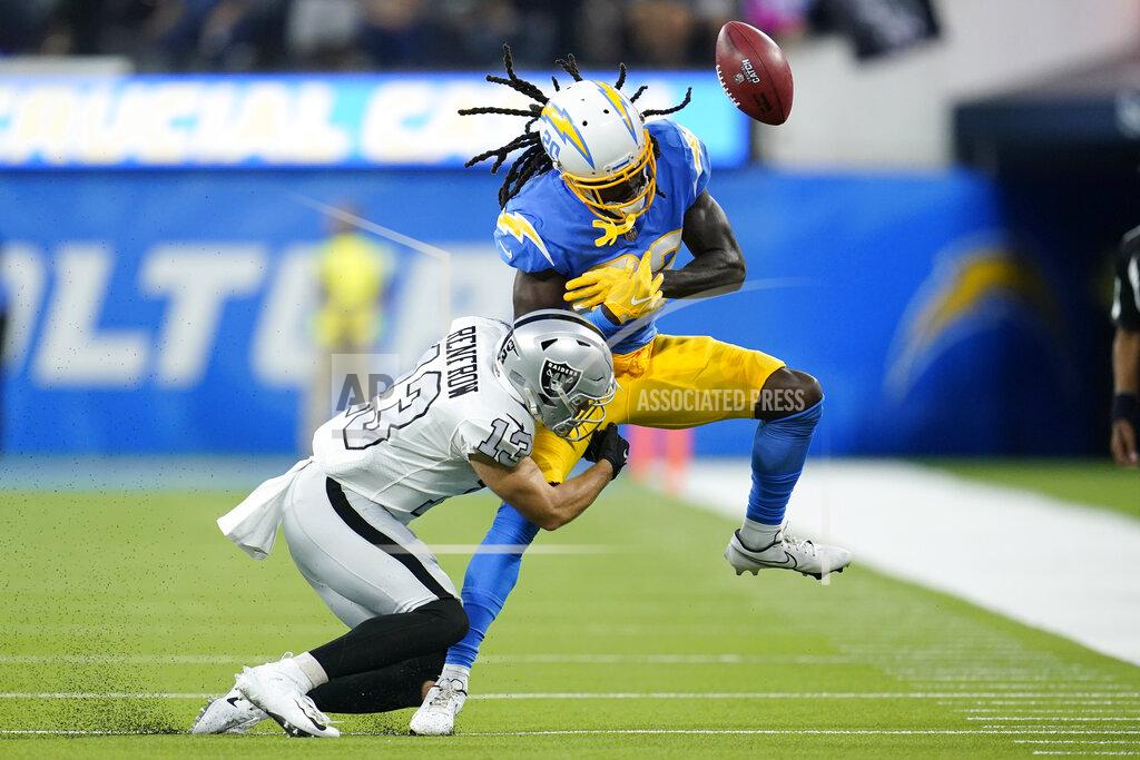 Marcio Jose Sanchez Los Angeles Chargers receiver Tevaughn Campbell can't make the catch as he is hit by Las Vegas Raiders defender Hunter Renfrow during the first half of an NFL football game Monday, Oct. 4, 2021, in Inglewood, Calif. (AP Photo/Marcio Jose Sanchez)