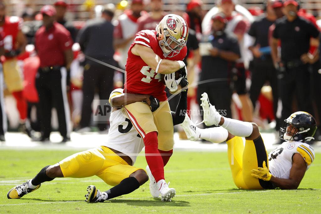 Ben Margot San Francisco 49ers fullback Kyle Juszczyk, center, runs between Pittsburgh Steelers strong safety Terrell Edmunds, left, and free safety Minkah Fitzpatrick during the first half of an NFL football game in Santa Clara, Calif., Sunday, Sept. 22, 2019. (AP Photo/Ben Margot)