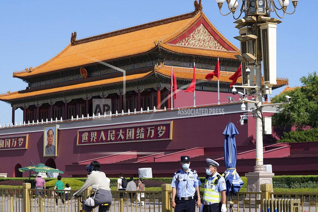 Ng Han Guan Chinese policemen stand on duty near Tiananmen Gate on the 32nd anniversary of a deadly crackdown on pro-democracy protests in Beijing on Friday, June 4, 2021. Commemorations of the June 4, 1989 crackdown on student-led pro-democracy protests centered on Beijing's Tiananmen Square were especially muted Friday amid pandemic control restrictions and increasing political repression. (AP Photo/Ng Han Guan)
