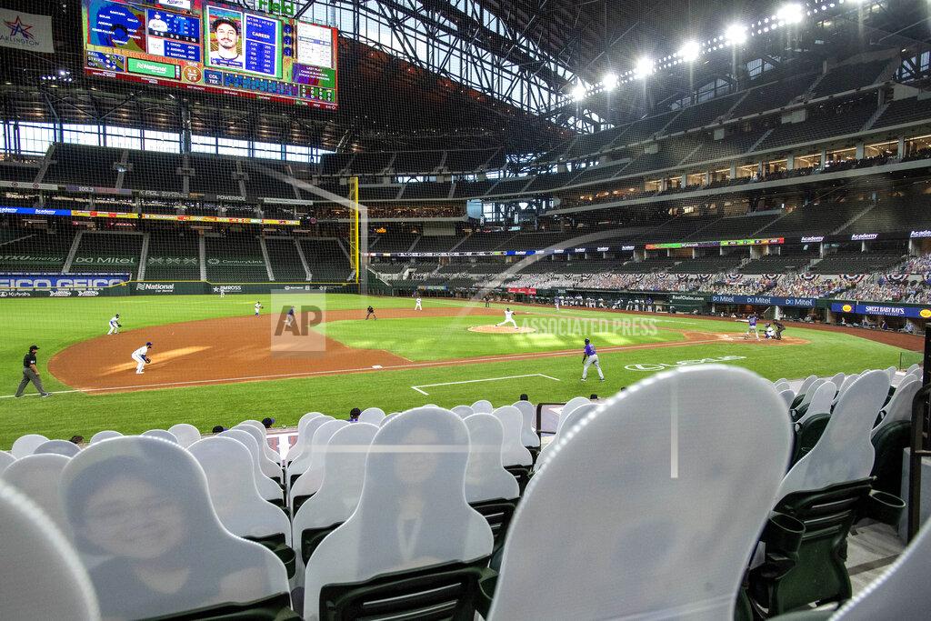 Jeffrey Mcwhorter The Texas Rangers and the Colorado Rockies play in front of cardboard cutouts depicting fans, dubbed "DoppleRangers," during the first inning of an opening day baseball game Friday, July 24, 2020, in Arlington, Texas. (AP Photo/Jeffrey McWhorter)