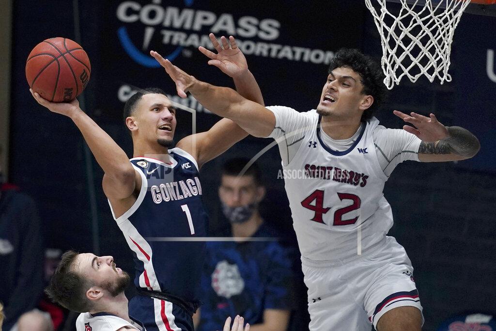 Jeff Chiu Gonzaga guard Jalen Suggs (1) shoots against Saint Mary's forward Dan Fotu (42) during the second half of an NCAA college basketball game in Moraga, Calif., Saturday, Jan. 16, 2021. (AP Photo/Jeff Chiu)