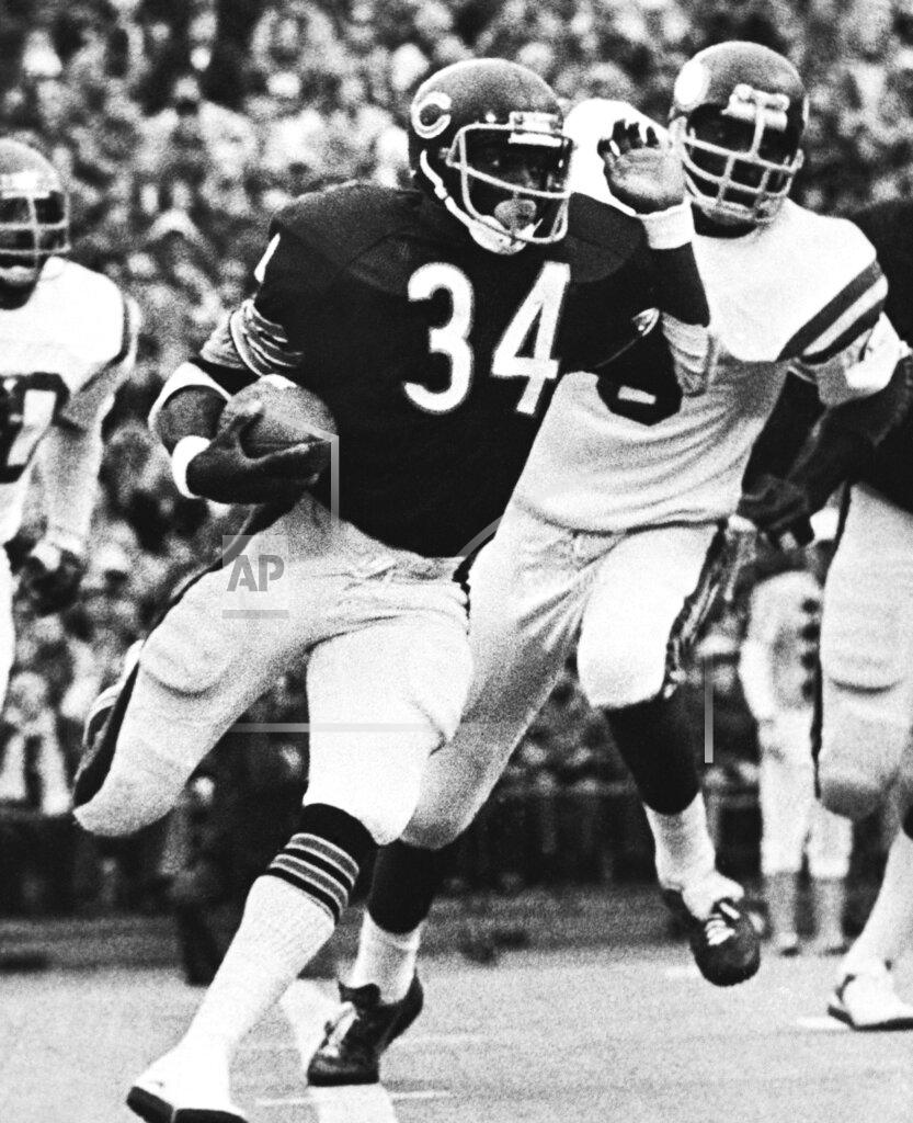 FILE - In this Nov. 20, 1977, file photo, Chicago Bears' Walter Payton (34) runs for three yards in first quarter of an NFL football game against the Minnesota Vikings in Chicago. Sweetness ran for 275 yards, a single-game record. (AP Photo/Fred Jewell, File_