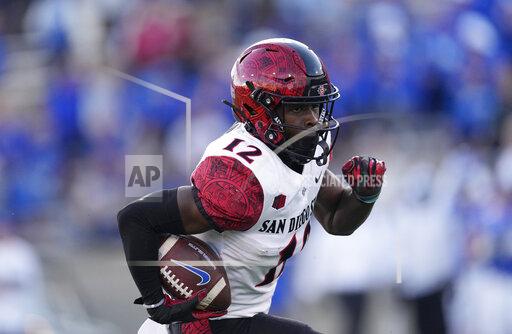 San Diego State cornerback Dallas Branch runs for a short gain after intercepting apass against Air Force in the first half of an NCAA college football game Saturday, Oct. 23, 2021, at Air Force Academy, Colo. (AP Photo/David Zalubowski)