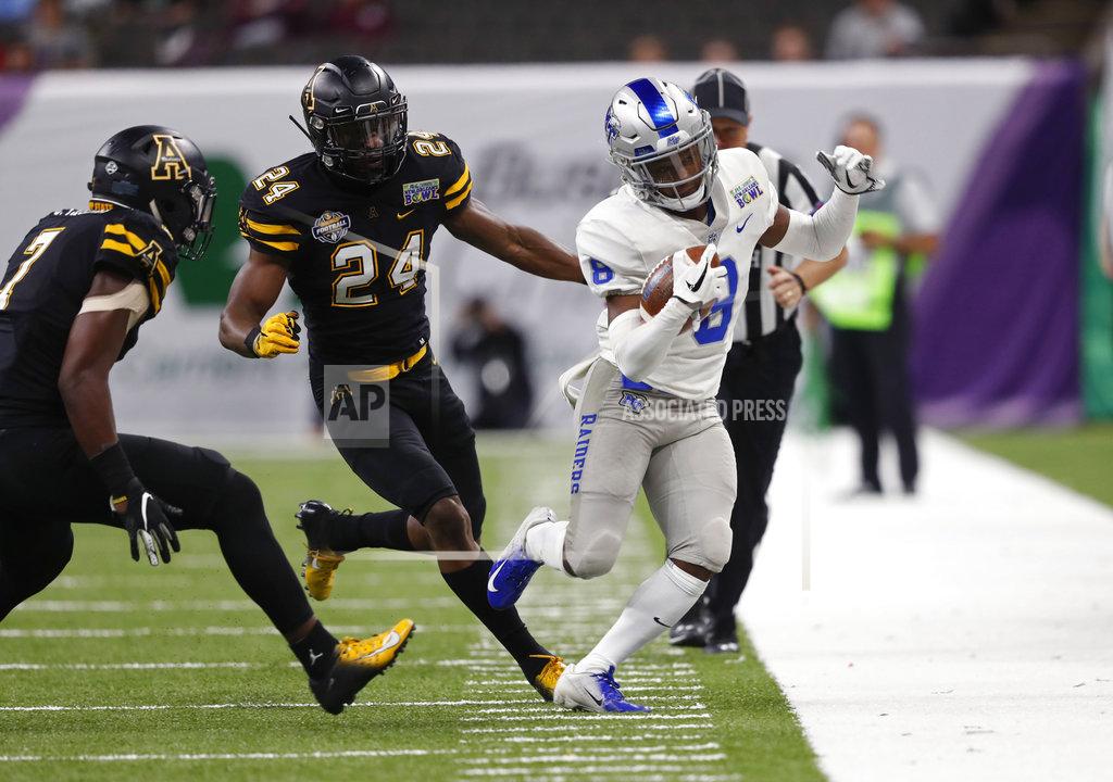 Gerald Herbert Middle Tennessee wide receiver Ty Lee (8) is chased out of bounds by Appalachian State linebacker Akeem Davis-Gaither (24) and defensive back Josh Thomas (7) in the first half of the New Orleans Bowl NCAA college football game in New Orleans, Saturday, Dec. 15, 2018. (AP Photo/Gerald Herbert)