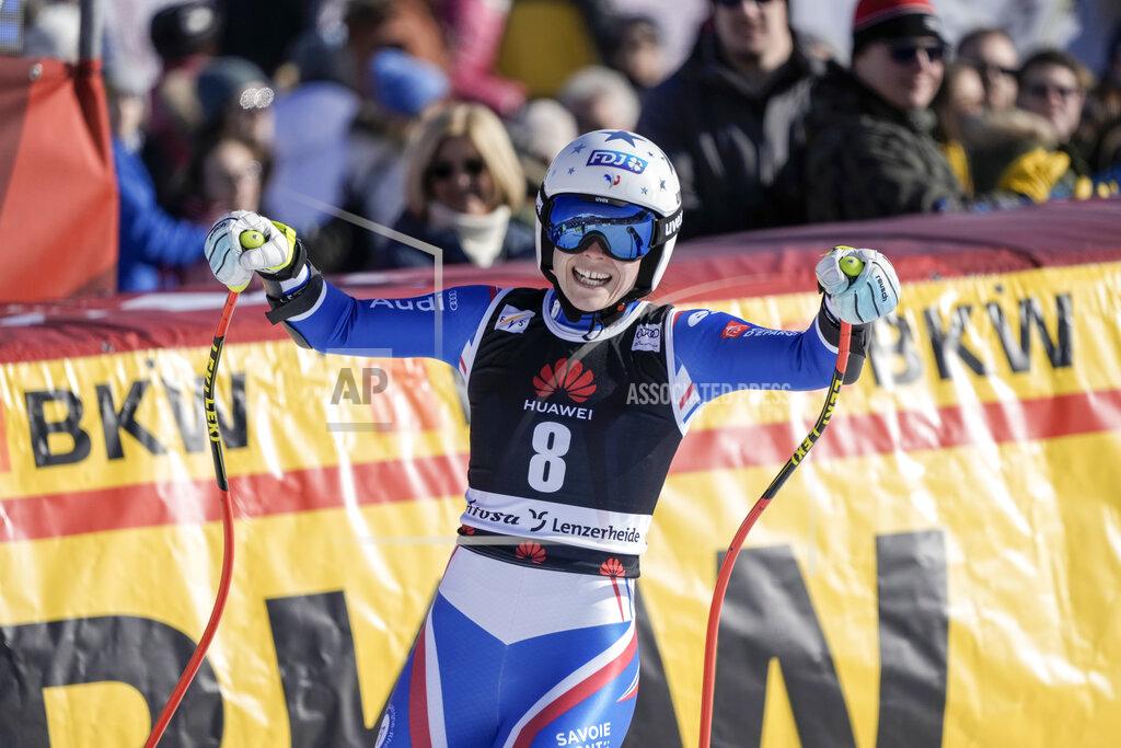 Giovanni Auletta France's Romane Miradoli reacts as she crosses the finish line of an alpine ski, women's World Cup super-G, in Lenzerheide, Switzerland, Saturday, March 5, 2022. (AP Photo/Giovanni Auletta)