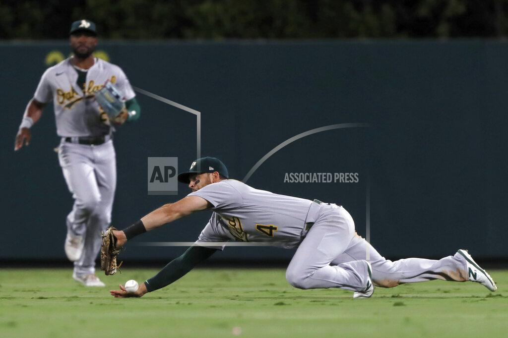 Alex Gallardo Oakland Athletics right fielder Chad Pinder can't catch a fly ball hit by Los Angeles Angels' Jared Walsh during the seventh inning of a baseball game in Anaheim, Calif., Saturday, Sept. 18, 2021. (AP Photo/Alex Gallardo)