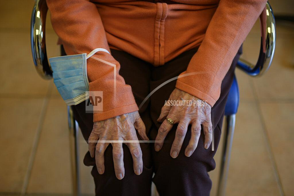 90 year old Maribel Elizondo, sits in the hair salon at Ibaneta nursing home, in the small village of Erro, around 30 kms (18 miles) from Pamplona, northern Spain, Monday, March 22, 2021. Every week, on Monday, hairdresser Gloria Cerdan attends to the residents at the nursing home. (AP Photo/Alvaro Barrientos)
