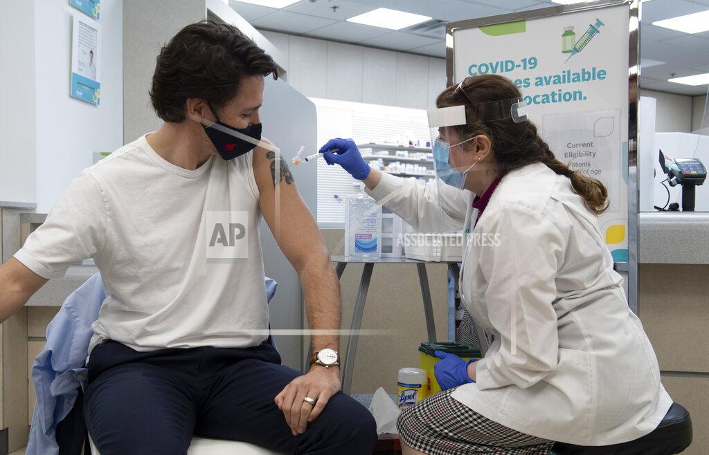 Adrian Wyld Prime Minister Justin Trudeau receives his first COVID vaccination in Ottawa, Friday April 23, 2021. (Adrian Wyld/The Canadian Press via AP)