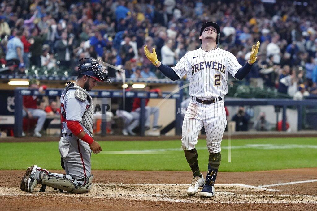 Morry Gash Milwaukee Brewers' Luis Urias celebrates after hitting a home run during the fifth inning of a baseball game against the Washington Nationals Saturday, May 21, 2022, in Milwaukee. (AP Photo/Morry Gash)
