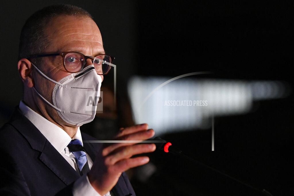 Andreea Alexandru World Health organization Director for Europe Hans Kluge speaks to media during a press conference where he said he would take an AstraZeneca vaccine when his turn comes for inoculation, at a vaccination center in Bucharest, Romania, Wednesday, April 7, 2021. British authorities recommended Wednesday that the AstraZeneca COVID-19 vaccine not be given to adults under 30 where possible because of strengthening evidence that the shot may be linked to rare blood clots, a recommendation that came as regulators both in the United Kingdom and the European Union emphasized that the benefits of receiving the vaccine continue to outweigh the risks for most people — even though the European Medicines Agency said it had found a "possible link" between the shot and the rare clots.(AP Photo/Andreea ALexandru)
