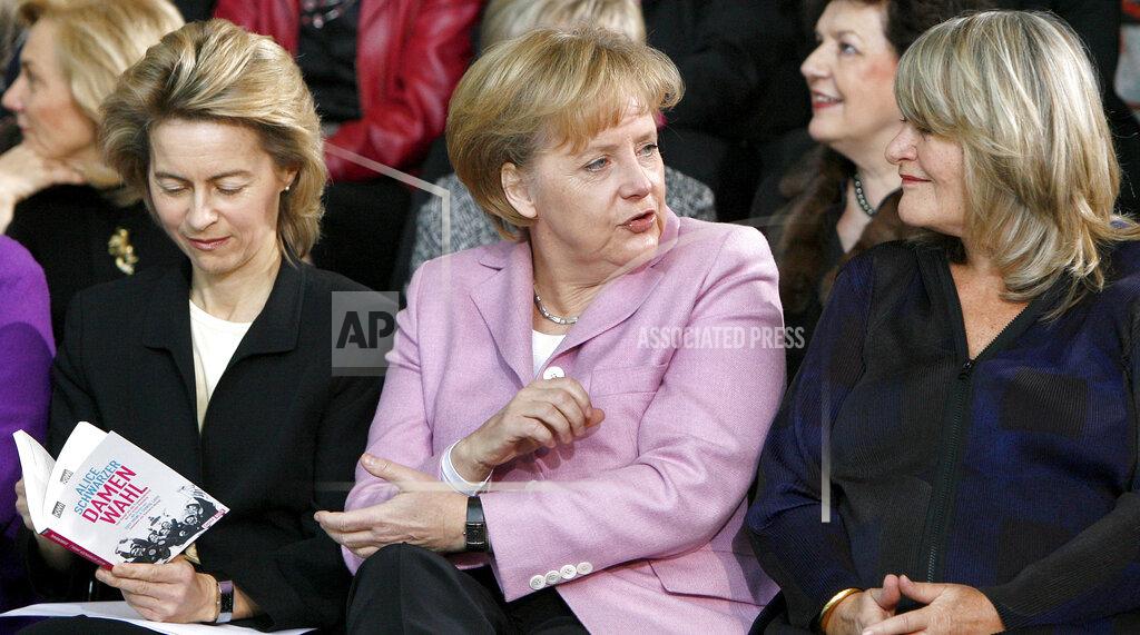 Michael Sohn FILE - In this Monday, Jan. 26, 2009 file photo, German Family Minister Ursula von der Leyen, German Chancellor Angela Merkel and the publisher Alice Schwarzer, from left, take part on a '90 years of women's right to vote' morning performance at the chancellory in Berlin, Germany. Millions of women admire the 67-year-old for breaking through the glass ceiling of male dominance in politics, and she’s been lauded as an impressive role model for girls both at home and around the globe. (AP Photo/Michael Sohn, File)