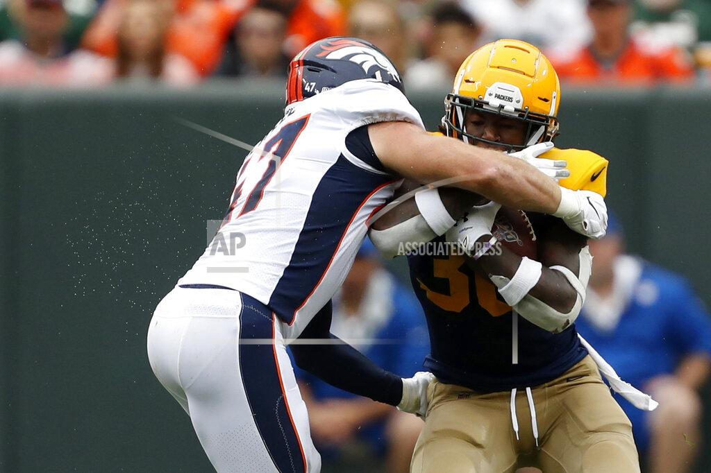 Matt Ludtke Green Bay Packers running back Jamaal Williams, right, collides with Denver Broncos inside linebacker Josey Jewell while running with the ball during the first half of an NFL football game Sunday, Sept. 22, 2019, in Green Bay, Wis. (AP Photo/Matt Ludtke)