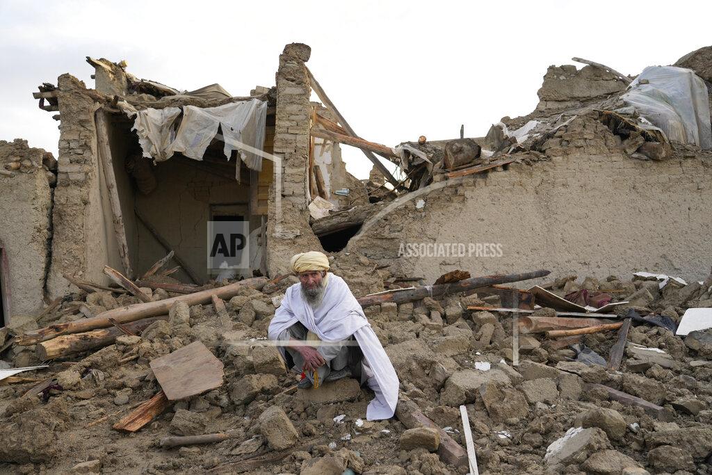 Ebrahim Noroozi An Afghan sits by the rubble of his house earthquake in Gayan village, in Paktika province, Afghanistan, Thursday, June 23, 2022. A powerful earthquake struck a rugged, mountainous region of eastern Afghanistan early Wednesday, flattening stone and mud-brick homes in the country's deadliest quake in two decades, the state-run news agency reported. (AP Photo/Ebrahim Nooroozi)