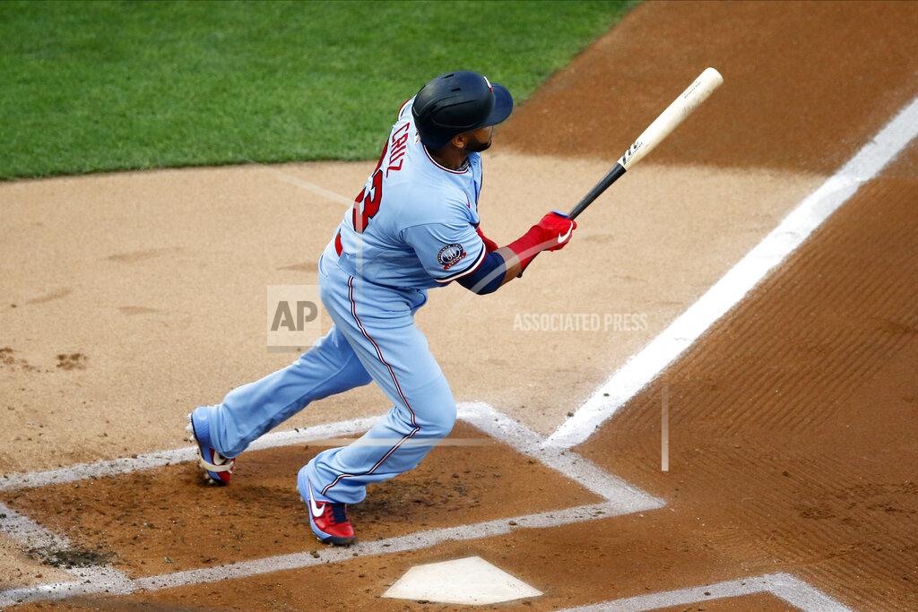 Jim Mone Minnesota Twins' Nelson Cruz hits an RBI double off St. Louis Cardinals pitcher Daniel Ponce de Leon in the first inning of a baseball game Wednesday, July 29, 2020, in Minneapolis. (AP Photo/Jim Mone)