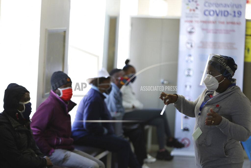 Siphiwe Sibeko FILE - In this Wednesday, June 24, 2020 file photo, a medical worker addresses some of the first vaccine volunteers, at the Chris Hani Baragwanath hospital in Soweto, Johannesburg. Refrigeration, cargo planes, and, above all, money: All risk being in short supply for the international initiative to get coronavirus vaccines to the world’s most vulnerable people. (AP Photo/Siphiwe Sibeko, File)