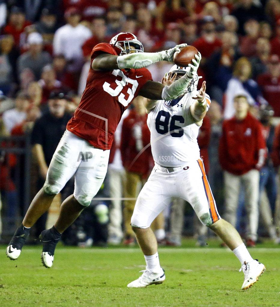 Butch Dill Alabama linebacker Anfernee Jennings (33) intercepts a pass intended for Auburn tight end Tucker Brown (86) during the second half of an NCAA college football game, Saturday, Nov. 24, 2018, in Tuscaloosa, Ala. (AP Photo/Butch Dill)