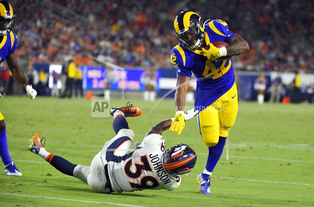 Mark J. Terrill Los Angeles Rams running back John Kelly, right, is tackled by Denver Broncos cornerback Trey Johnson (39) during the second half of an NFL preseason football game Saturday, Aug. 24, 2019, in Los Angeles. (AP Photo/Mark J. Terrill)