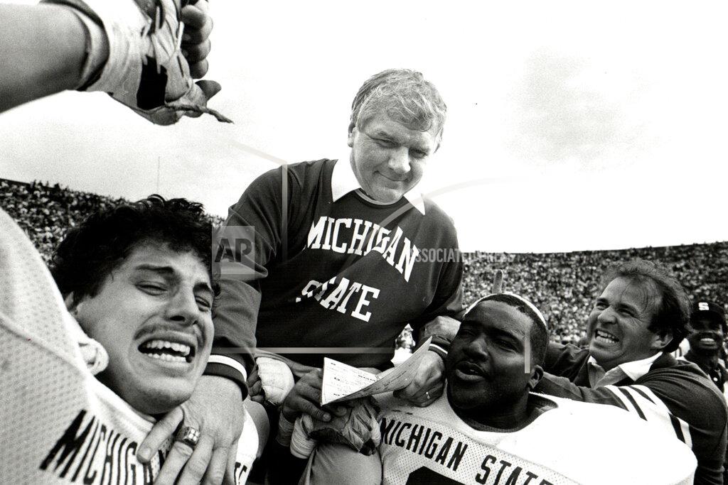 Manny Crisostomo In this 1984 photo, Michigan state NCAA college football head coach George Perles gets lifted on the shoulders of team members after a victory. George Perles, who coached Michigan State to a Rose Bowl victory in 1988 and was an assistant for the dominant Pittsburgh Steelers teams of the 1970s that won four Super Bowls, died Tuesday, Jan. 7, 2020, the school said. He was 85. (Manny Crisostomo/Detroit Free Press via AP)