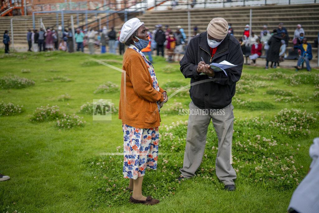 Jerome Delay Residents from the Alexandra township in Johannesburg gather in a stadium to be tested for COVID-19 Monday, April 26, 2020. South Africa will began a phased easing of its strict lockdown measures on May 1, although its confirmed cases of coronavirus continue to increase. (AP Photo/Jerome Delay)