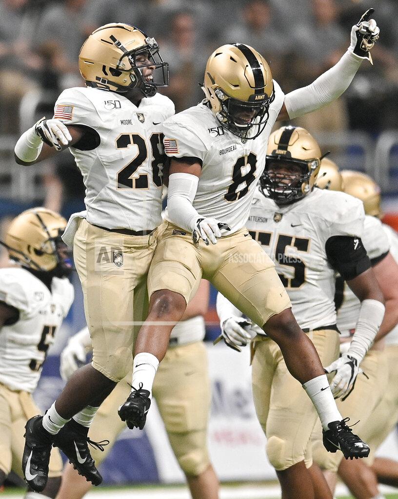 Darren Abate Army's Javhari Bourdeau (8) and Jabari Moore celebrate a forced UTSA turnover during the second half of an NCAA college football game Saturday, Sept. 14, 2019, in San Antonio. (AP Photo/Darren Abate)