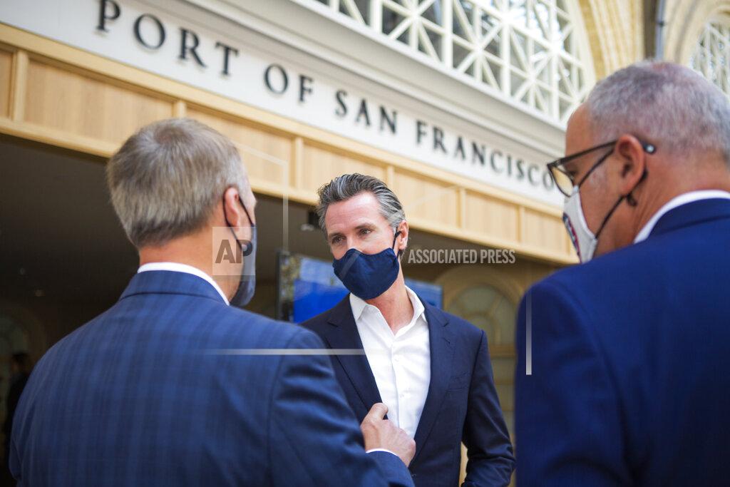 Nina Riggio California Gov. Gavin Newsom visits with people at the Ferry Building after speaking at a press conference in San Francisco on Monday, June 14, 2021. California will offer six "dream vacation" incentives to spur more people to get coronavirus vaccinations, Gov. Gavin Newsom said Monday on the eve of the state's awarding of $15 million in cash prizes. Goodies in the package include floor seats at an NBA game with the LA Lakers, and tickets to Disneyland, Legoland, SeaWorld and a symphony, he said. (Nina Riggio/San Francisco Chronicle via AP)