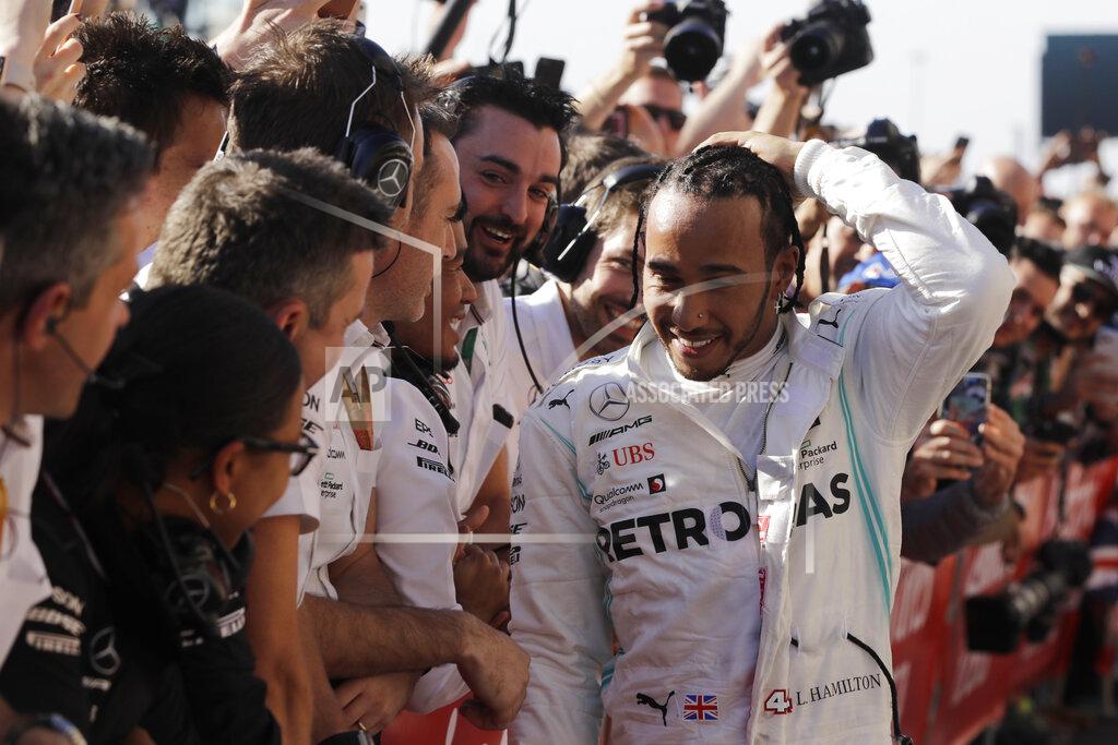 Darron Cummings Six-time world champion Mercedes driver Lewis Hamilton, of Britain, is congratulated by his teammates after the Formula One U.S. Grand Prix auto race at the Circuit of the Americas, Sunday, Nov. 3, 2019, in Austin, Texas. (AP Photo/Darron Cummings)
