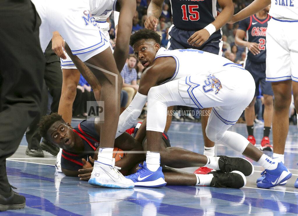 Karen Pulfer Focht Memphis' Damion Baugh (10) and Mississippi Sammy Hunter (23) battle for the ball in the first half of an NCAA college basketball game Saturday, Nov. 23, 2019, in Memphis, Tenn. (AP Photo/Karen Pulfer Focht)