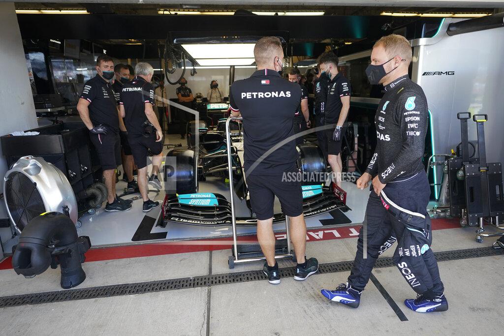 Darron Cummings Mercedes driver Valtteri Bottas, of Finland, walks in front of his garage before a practice session for the F1 US Grand Prix auto race at the Circuit of the Americas, Friday, Oct. 22, 2021, in Austin, Texas. (AP Photo/Darron Cummings)