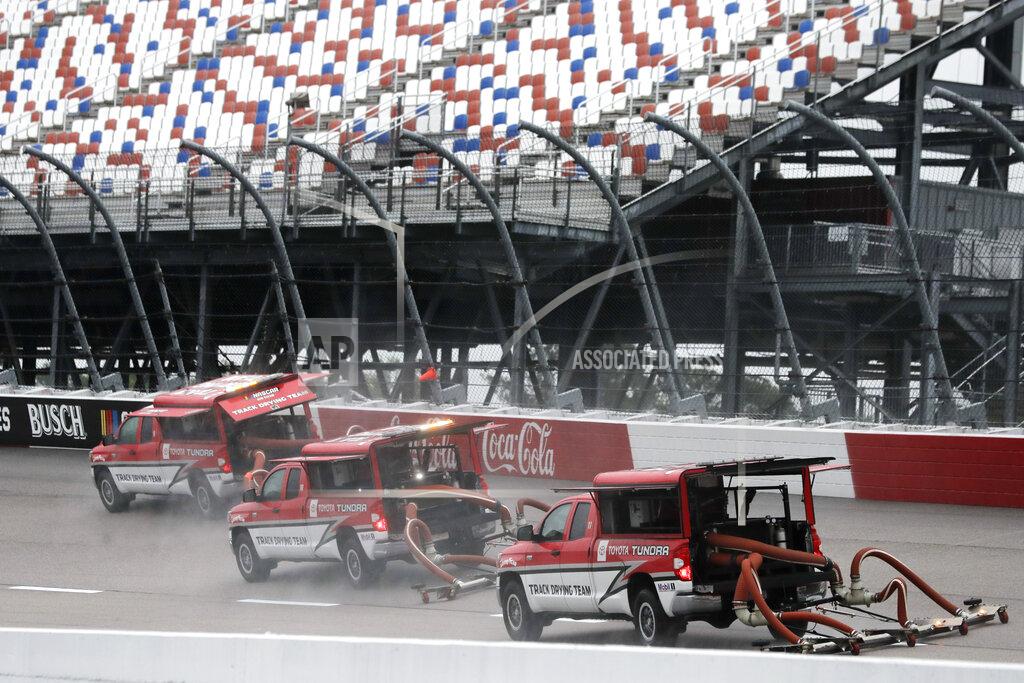 Brynn Anderson A crew tries to dry off the track after a rain before the Toyota 500 NASCAR Cup Series auto race Wednesday, May 20, 2020, in Darlington, Tenn. (AP Photo/Brynn Anderson)