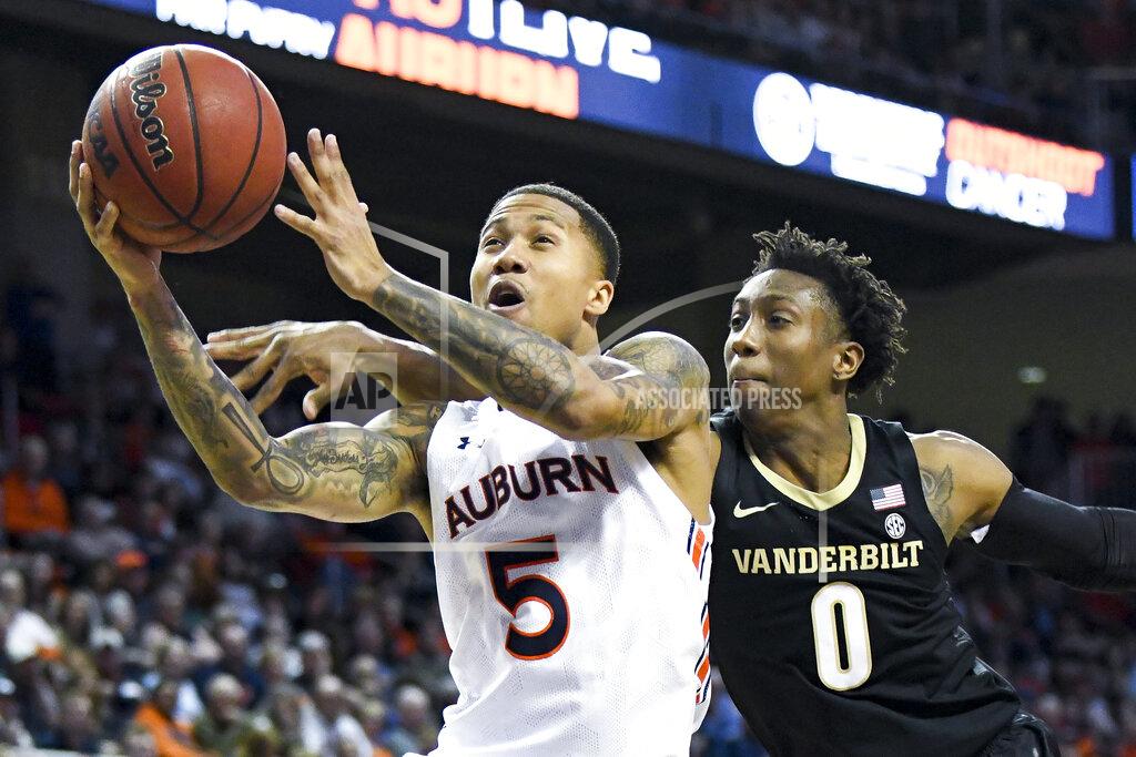 Julie Bennett Vanderbilt guard Saben Lee (0) defends a drive to the basket by Auburn guard J'Von McCormick (5) during the second half of an NCAA college basketball game Wednesday, Jan. 8, 2020, in Auburn, Ala. (AP Photo/Julie Bennett)