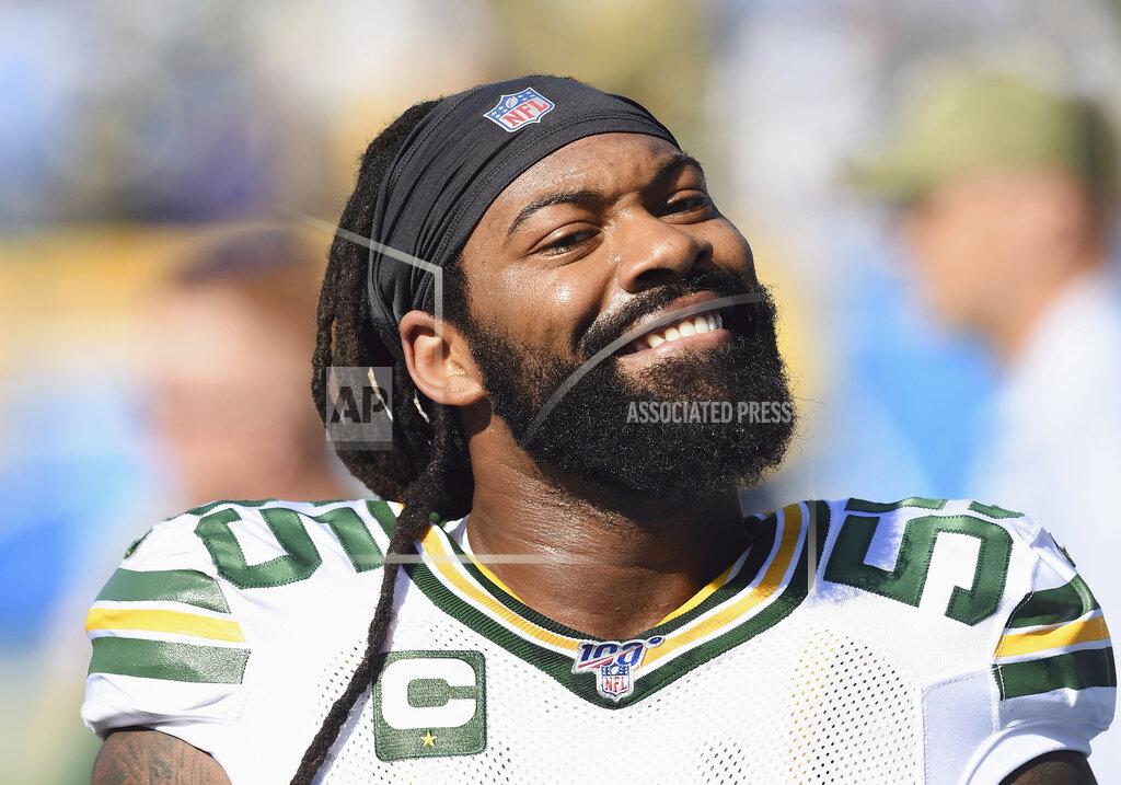 John Cordes FILE - In this Sunday, Nov. 3, 2019, file photo, Green Bay Packers linebacker Za'Darius Smith (55) smiles towards the stands and a section of Packers fans before an NFL football game against the Los Angeles Chargers in Carson, Calif. Za’Darius Smith and Preston Smith aren’t related, but the Packers pass rushers share the same last name and the same type of productive games. They combined for 25 ½ sacks last season after both signed with the Packers as free agents in early 2019. (AP Photo/John Cordes, FIler)