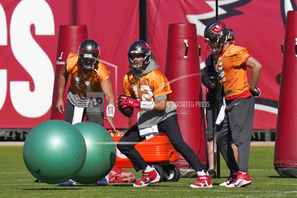 Chris O'meara Tampa Bay Buccaneers quarterback Tom Brady (12) runs through a drill during an NFL football practice Wednesday, Jan. 6, 2021, in Tampa, Fla. The Buccaneers play the Washington Football Team in a playoff game Saturday night. (AP Photo/Chris O'Meara)