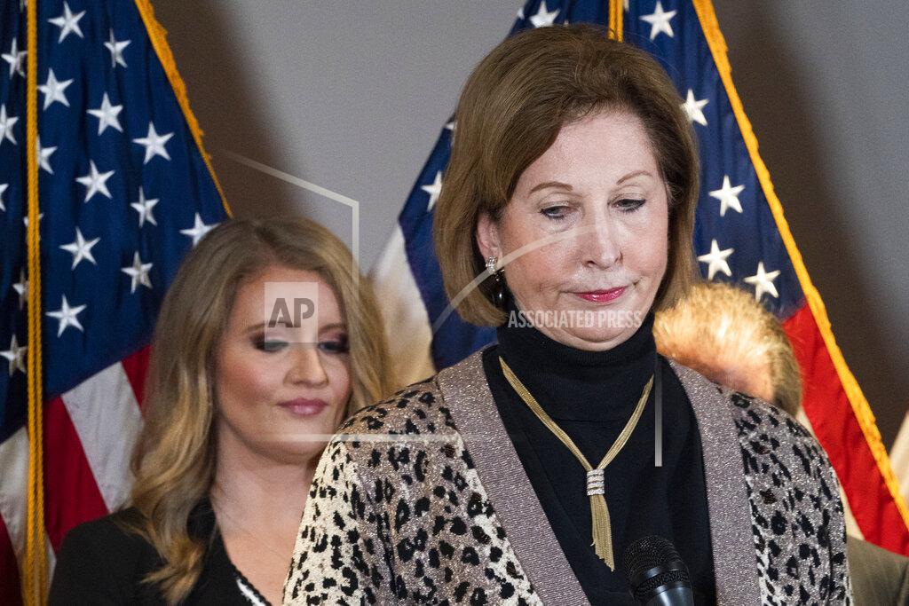 Members of President Donald Trump's legal team, Sidney Powell, right, with Jenna Ellis, left, attend a news conference at the Republican National Committee headquarters, Thursday Nov. 19, 2020, in Washington. (AP Photo/Jacquelyn Martin)