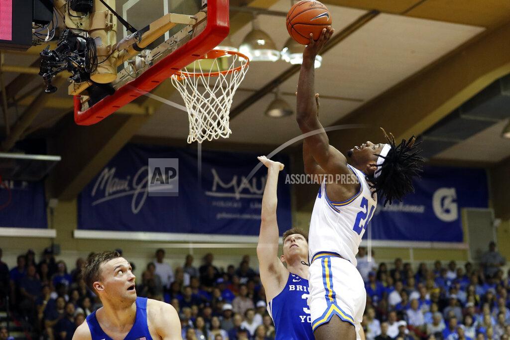 Marco Garcia UCLA forward Jalen Hill (24) shoots over BYU forward Dalton Nixon (33) during the first half of an NCAA college basketball game, Monday, Nov. 25, 2019, in Lahaina, Hawaii. (AP Photo/Marco Garcia)