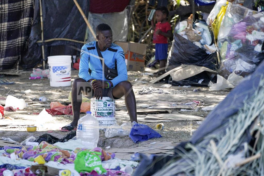Julio Cortez FILE - In this Sept. 23, 2021, file photo, a migrant man is seen in an encampment under the Del Rio International Bridge where migrants, many from Haiti, have been staying after crossing the Rio Grande, in Del Rio, Texas. The Border Patrol's treatment of Haitian migrants, they say, is just the latest in a long history of discriminatory U.S. policies and of indignities faced by Black people, sparking new anger among Haitian Americans, Black immigrant advocates and civil rights leaders. (AP Photo/Julio Cortez)