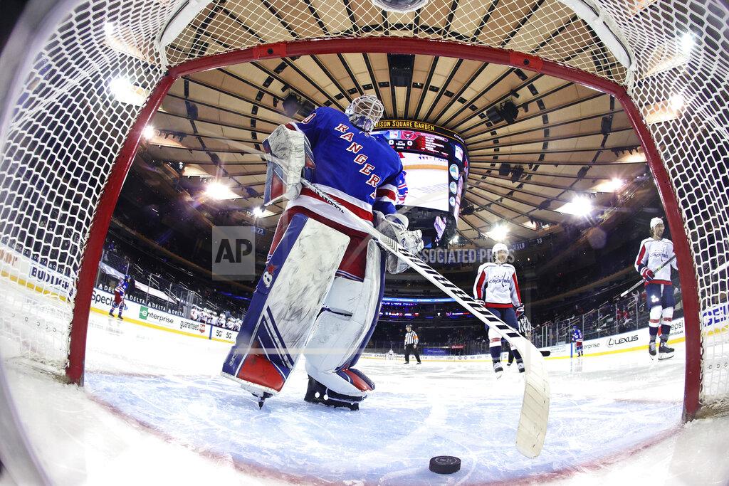 Bruce Bennett New York Rangers' Alexandar Georgiev takes the puck from the net following a second-period goal by Washington Capitals' T.J. Oshie (77) during an NHL hockey game Wednesday, May 5, 2021, in New York. (Bruce Bennett/Pool Photo via AP)