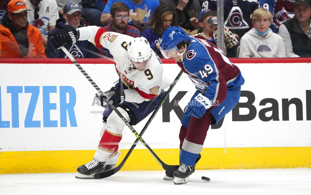 David Zalubowski Florida Panthers center Sam Bennett, left, battles for control of the puck with Colorado Avalanche defenseman Samuel Girard in the second period of an NHL hockey game Sunday, Dec. 12, 2021, in Denver. (AP Photo/David Zalubowski)