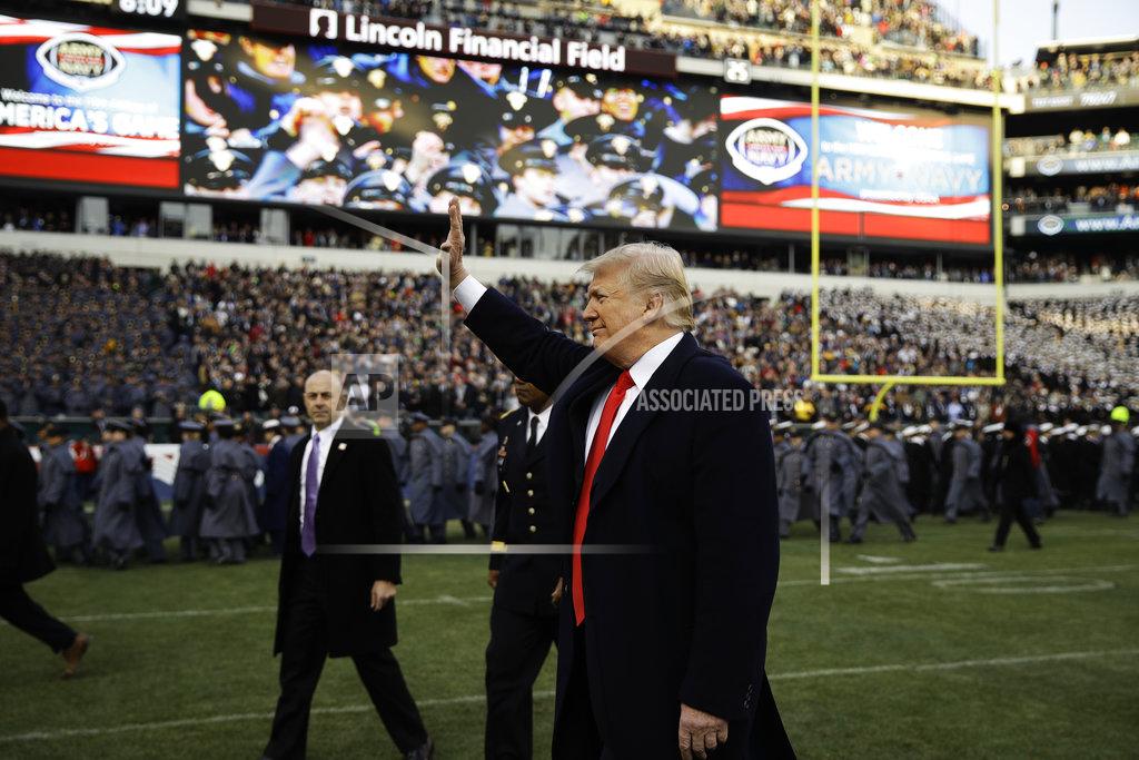 Matt Rourke President Donald Trump waves to attendees ahead of an NCAA college football game between Army and Navy, Saturday, Dec. 8, 2018, in Philadelphia. (AP Photo/Matt Rourke)