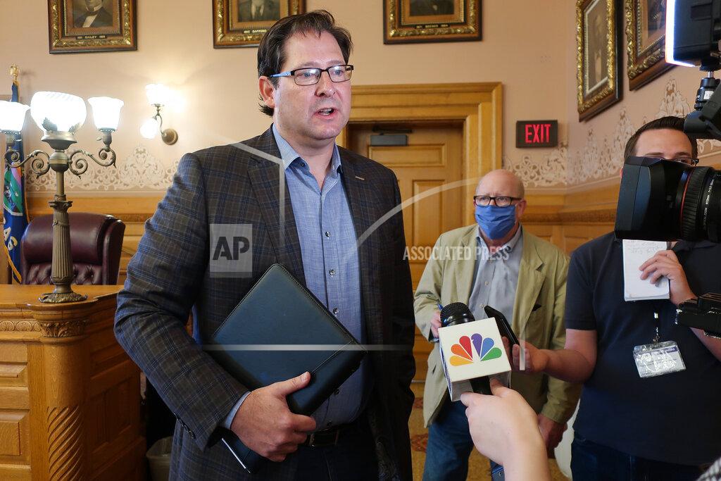 John Hanna Kansas House Speaker Ron Ryckman Jr., R-Olathe, speaks with reporters following a meeting of legisative leaders with Democratic Gov. Laura Kelly, Friday, June 26, 2020, at the Statehouse in Topeka, Kan. Ryckman says a plan from Kelly to erase a budget shortfall that arose amid the coronavirus pandemic merely pushes the state's financial problems off a year. (AP Photo/John Hanna)