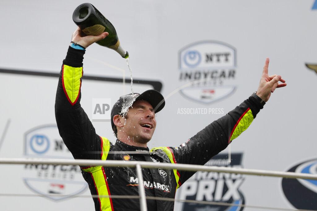 Michael Conroy Simon Pagenaud, of France, celebrates after winning the Indy GP IndyCar auto race at Indianapolis Motor Speedway, Saturday, May 11, 2019, in Indianapolis. (AP Photo/Michael Conroy)