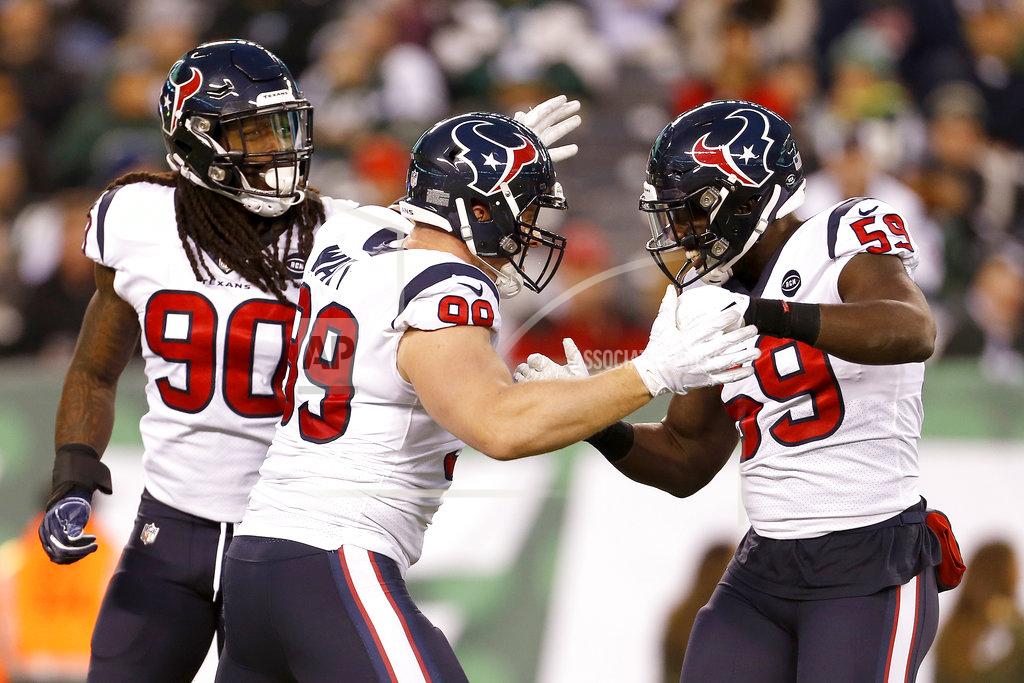 Adam Hunger FILE - In this Dec. 15, 2018, file photo, Houston Texans defensive end J.J. Watt (99) is congratulated by outside linebackers Whitney Mercilus (59) and Jadeveon Clowney (90) after recording a sack on New York Jets quarterback Sam Darnold during the first half of an NFL football game in East Rutherford, N.J. Watt played all 16 games this season after starting just eight games combined in the previous two years because of back surgeries and a broken leg. Watt led the AFC with 16 sacks, had 25 quarterback hits, 18 tackles for losses and forced a career-high seven fumbles, which tied for most in NFL. (AP Photo/Adam Hunger, File)