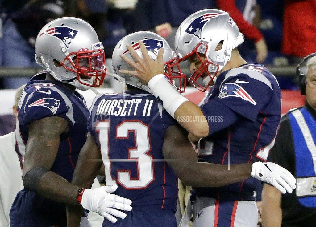 Steven Senne New England Patriots quarterback Tom Brady, right, celebrates his touchdown pass to Phillip Dorsett, center, in the second half of an NFL football game against the Pittsburgh Steelers, Sunday, Sept. 8, 2019, in Foxborough, Mass. (AP Photo/Steven Senne)