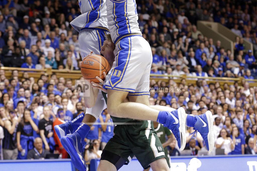 Gerry Broome Colorado State forward Adam Thistlewood (31) drives between Duke forward Joey Baker, right and forward Javin DeLaurier during the first half of an NCAA college basketball game in Durham, N.C., Friday, Nov. 8, 2019. (AP Photo/Gerry Broome)