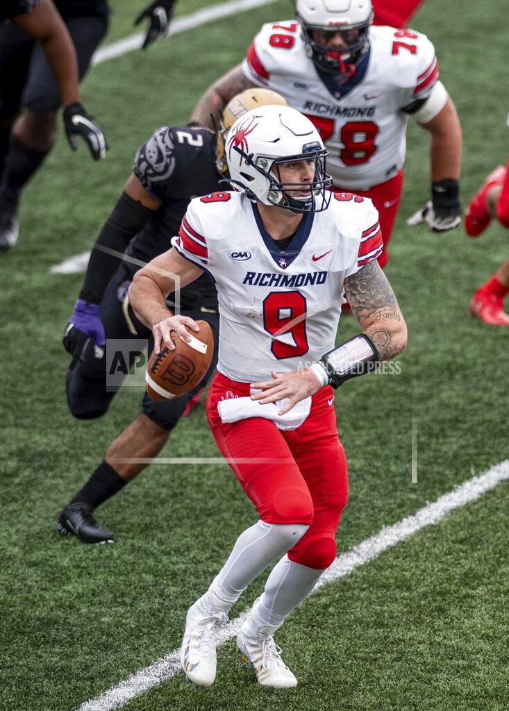 Daniel Lin Richmond quarterback Joe Mancuso (9) looks for an open receiver downfield during the first half of an NCAA college football game against James Madison in Harrisonburg, Va., Saturday, April 17, 2021. (Daniel Lin/Daily News-Record Via AP)