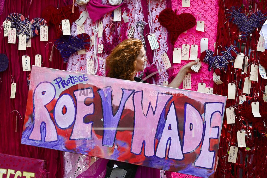 Matt Marton FILE - Jacqueline Von Edelbe holds a sign with other abortion rights demonstrators May 14, 2022, in Chicago. Reproductive rights advocates are planning to open new abortion clinics or expand the capacity of existing ones in states without restrictive abortion laws. (AP Photo/Matt Marton, File)