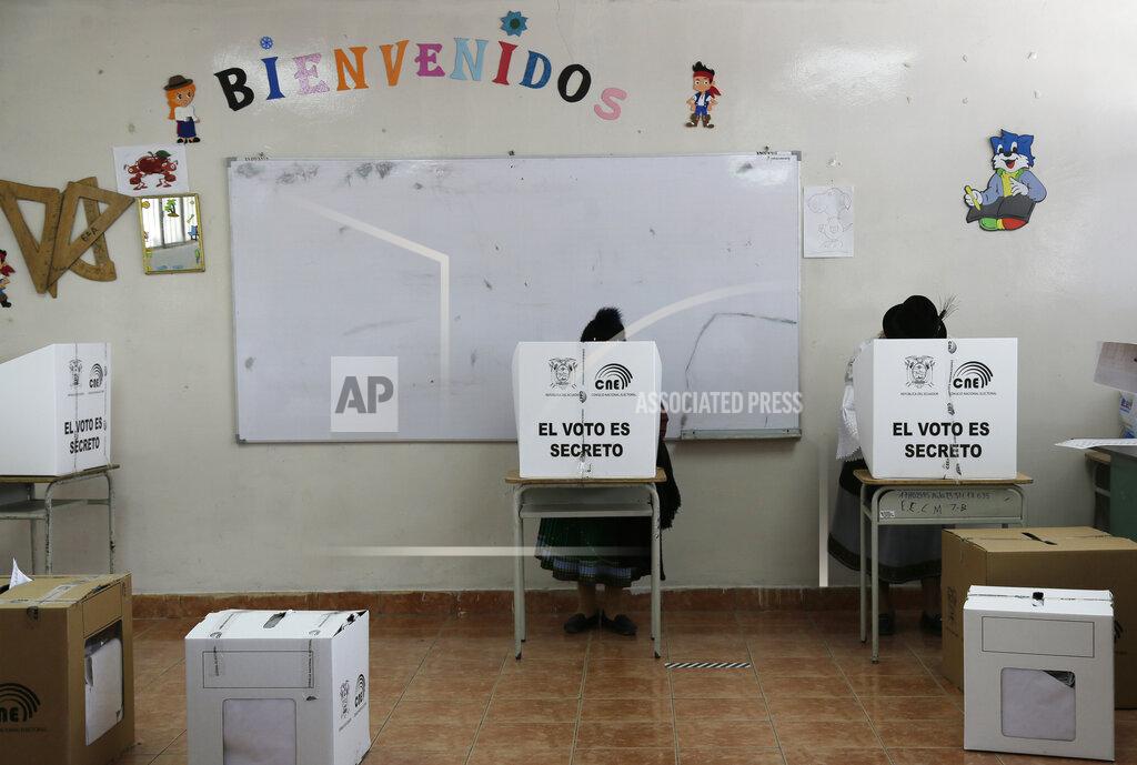 Dolores Ochoa Women cast their ballots in Cangahua, Ecuador, Sunday, Feb. 7, 2021. Ecuadoreans went to the polls in first-round presidential and legislative elections. (AP Photo/Dolores Ochoa)