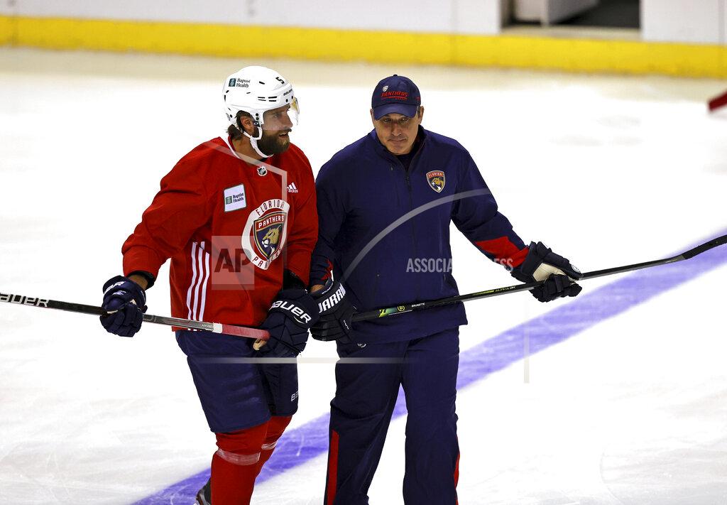 David Santiago Florida Panthers assistant coach Andrew Brunette, right, skates with defenseman Aaron Ekblad (5) during an NHL hockey training camp Thursday, Sept. 23, 2021, in Sunrise, Fla. (David Santiago/Miami Herald via AP)