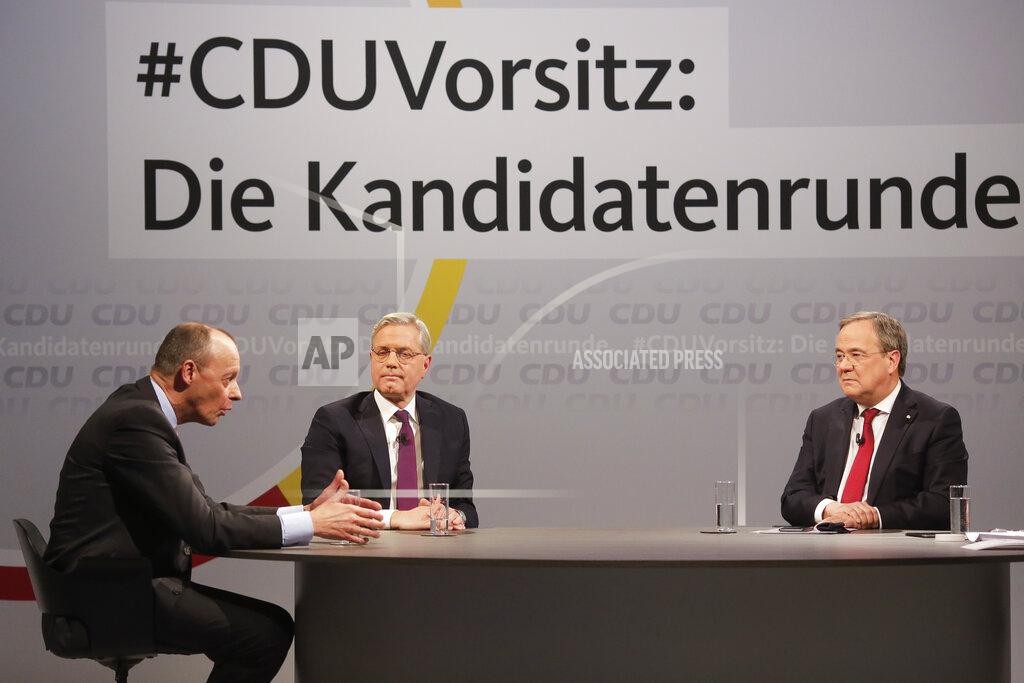 Markus Schreiber FILE - In this Dec. 14, 2020 file photo, the three candidates for the chairmanship of the Christian Democratic Union party, CDU, Friedrich Merz, left, Norbert Roettgen, center, and Armin Laschet, right, take part in a discussion at the party's headquarters in Berlin, Germany, Monday, Dec. 14, 2020. Background slogan reads: 'CDU Chairmanship: The candidate round'. The coronavirus pandemic is colliding with politics as Germany embarks on its vaccination drive and one of the most unpredictable election years in its post-World War II history.(AP Photo /Markus Schreiber, File)