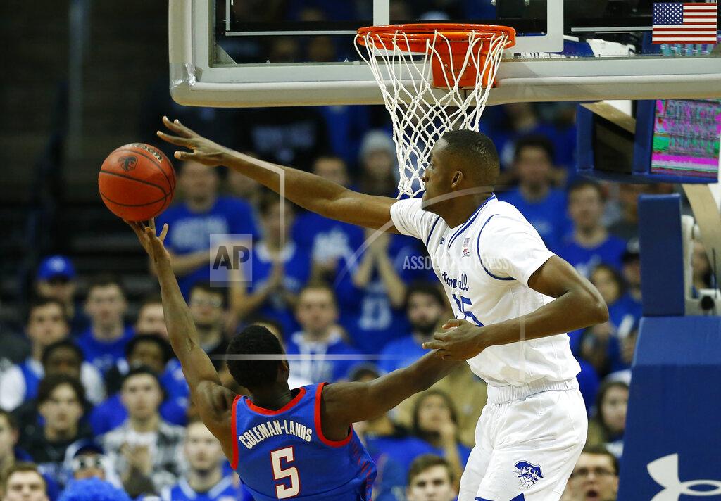 Noah K. Murray Seton Hall's Romaro Gill blocks the shot of DePaul's Jalen Coleman-Lands (5) during the second half of an NCAA college basketball game Wednesday, Jan. 29, 2020, in Newark, N.J. (AP Photo/Noah K. Murray)
