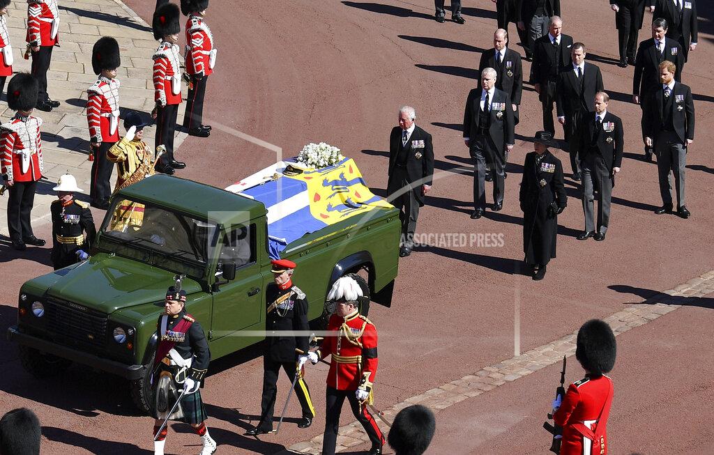 Justin Tallis Family members follow the coffin arriving at St George's Chapel for the funeral of Britain's Prince Philip inside Windsor Castle in Windsor, England, Saturday, April 17, 2021. Prince Philip died April 9 at the age of 99 after 73 years of marriage to Britain's Queen Elizabeth II. (Justin Tallis/Pool via AP)